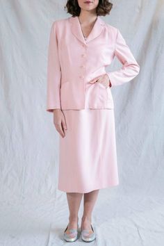 Elegant Pink Blazer With Welt Pockets, Classic Pink Blazer With Notch Lapel, Pink Office Blazer With Welt Pockets, Elegant Formal Wool Skirt Suit, Elegant Wool Skirt Suit For Formal Occasions, Tailored Classic Skirt Suit, Classic Pink Single Breasted Blazer, Classic Pink Single-breasted Blazer, Pink Single Breasted Elegant Blazer