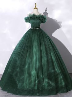 Radiate utter beauty in this exquisitely crafted Kemedress creation. Metallic lace appliques and tiny jewels are meticulously placed throughout the off the shoulder sweetheart neckline and corset styled bodice of this dark green ball gown. The sumptuous tulle skirt is dotted with metallic appliques and pleats, streaming into a train, and adorned with delicate crystal embellishments. Be the center of attention in this Kemedress masterpiece. Prom Dress Green, Tulle Neckline, Sweet 16 Dress, Off Shoulder Evening Dress, Green Evening Dress, Green Tulle, 16 Dress, Tulle Sleeves, Long Prom Gowns