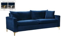 a blue velvet couch with gold legs and pillows on it's left hand side