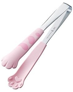 two pairs of pink scissors with white handles and feet that are shaped like paw prints