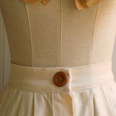 "This item is handmade in pure cotton fabric. Wonderful Italian fabric. Soft but firm hand. The skirt is made with small lateral folds both front and back. It has a short placket on the front, with a metal ciappa. Equipped with a 4 cm high corset, calculated for natural life. The placket with wooden buttons is fake. Finished internally, without lining. It is an elegant garment suitable for special occasions but also casual for use with flat shoes on a daily basis. Made of pure cotton fabric. Des Classic Cotton Pleated Skirt With Accordion Pleats, Classic Cotton Pleated Waist Skirt, Long Cotton Gathered Skirt, Cotton Pleated Relaxed Fit Skirt, Cotton Full Gathered Skirt, Classic Cotton Pleated Skirt For Spring, Cotton Full Skirt With Gathered Details, Elegant Cotton Pleated Full Skirt, Summer Cotton Skirt With Accordion Pleats