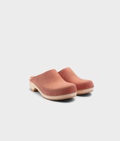 Elevate your everyday style with our minimalist clog mule, featuring clean lines and a timeless aesthetic that effortlessly transitions from day to night. Clog measurements:Heel height: 1 3/4” (4.5 cm)Toe height: 1 5/8″ (4.1 cm) Fit:RegularLeather:Nubuck leather Clogs consist of:Base: European Lime Wood Sole: Rubber sole Fastening: Staples Modern Slip-on Clogs With Textured Sole, Modern Slip-on Clogs With Reinforced Heel, Modern Suede Slip-on Clogs, Medium Width Leather Sole Slip-on Clogs, Playful Non-slip Synthetic Clogs, Cork Sandals, Pink October, Clog Sandals, Wooden Clogs