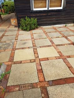 a small black house with a red and white checkerboard pattern on the floor