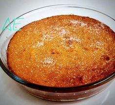 a cake in a glass dish on a table