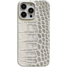 an iphone case with white alligator skin and black buttons on the back, in front of a