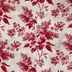 a red and white floral pattern on fabric