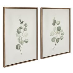 two framed paintings with green leaves on them