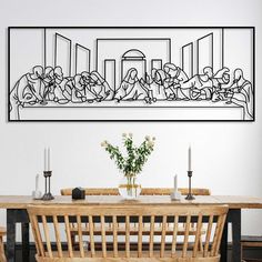 a dining room table with chairs and a large drawing on the wall above it that has people eating