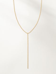 Ball Chain Lariat Necklace | Gold | Product Image | Uncommon James Minimalist Long Lariat Necklace With Adjustable Chain, Adjustable Y-shape Lariat Necklace, Dainty Adjustable Lariat Body Chain, Dainty Lariat Body Chain With Adjustable Chain, Dainty Lariat Gold Chain Necklace, Dainty Lariat Clavicle Body Chain, Minimalist Delicate Lariat Body Chain, Dainty Clavicle Lariat Body Chain, Dainty Delicate Chain Long Drop Necklace