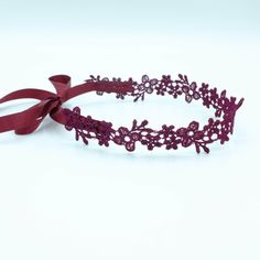 This eye-catching Astrid Burgundy Lace Choker Necklace is the ideal boho choker with satin ribbon to complete your chic look. Your go-to pick for expressing your boho style with a playful ribbon quirk. Ties up with a satin ribbon, giving you freedom over adjustability. Delicate yet durable Lightweight, wear-resistant design Blends it well with other jewelry items Flexible and feels easy on the skin Seamlessly ties up with satin ribbon Non-fraying edges keep the form intact Adjustable Fit LACE CH Adjustable Band Headband As Gift, Elegant Adjustable Headband For Gift, Elegant Adjustable Ribbon Headband, Bohemian Adjustable Headband For Gift, Adjustable Butterfly Knot Hair Accessory For Gift, Adjustable Ribbon Hair Accessories For Parties, Adjustable Hair Accessories With Butterfly Knot For Gifts, Adjustable Burgundy Jewelry For Party, Bohemian Adjustable Wedding Choker