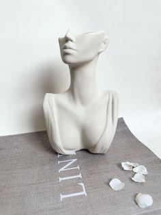 a white sculpture sitting on top of a table