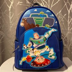 Bnwt Disney Loungefly Toy Story Backpack Fast Next Day Shipping Disney Backpack For Theme Park And Back To School, Blue Themed Back-to-school Bag, Character Style Travel Backpack, Character Style Standard Backpack For Travel, Themed Backpack For Theme Park, Themed Travel Bags For Back To School, Themed Standard Backpack For Theme Park, Back To School Backpack For Theme Park, Playful Backpack For Disney Trips