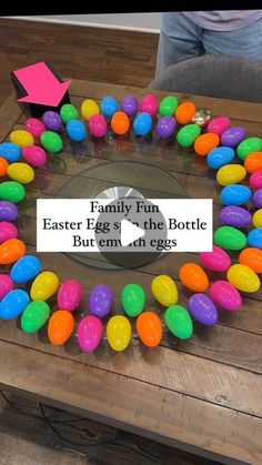 an easter egg wreath on a table with the words family fun written in front of it