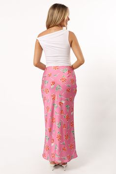 DETAILS   This midi length skirt is the perfect addition to your wardrobe. The slip style with invisible side zip ensures a comfortable fit, while the floral print detail gives it an extra touch of fun.    slip style skirt    midi length   invisible side zip  floral print design  soft satin feel   lined     material - 100% polyester     SIZING     model is 5' 5" and wears a Size XS    model stats: bust - 31.5", waist - 25.5", hips - 37"         GARMENT CARE    cold hand wash separately Floral Print Rayon Midi Skirt, Rayon Midi Skirt With Floral Print, Spring Asymmetrical Skirt With Side Slits, Asymmetrical Skirt With Side Slits For Spring, Fitted Floral Print Maxi Skirt For Brunch, Spring Midi Skirt With Side Slits, Spring Skirt With Side Slits For Day Out, Spring Day Out Skirt With Side Slits, Feminine Asymmetrical Floral Print Skirt