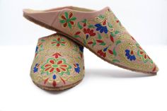 Bring a Moroccan touch to your outfit with these leather mules for women. They are hand stitched in a family workshop in the heart of the medina of Marrakesh using naturally tanned leather. The upper is decorated with multi colored pompoms, tassels and embroideries. A Moroccan pompom slippers handmade in Marrakesh, known for its quality leather. In fact, this city has one of the oldest tanneries in the kingdom where leather is still working in a natural way. Hurry, take advantage of our best off Traditional Handmade Closed Toe Clogs, Handmade Traditional Closed Toe Clogs, Traditional Handmade Slippers For Spring, Traditional Closed Toe Mules For Spring, Traditional Round Toe Slippers For Spring, Traditional Slip-on Mules For Spring, Traditional Handmade Mules, Traditional Leather Mules For Spring, Traditional Leather Clogs For Spring