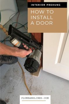 a person using a power tool to install a door