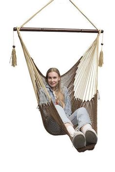 a woman sitting in a hammock chair