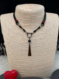 -A beautiful necklace ! -Black necklace  with a red  touch. -Original handmade. -A necklace that combines natural onyx stones,rubber and metals. -Blackened metals from  brass plated with oxidized silver. -The necklace is not leather. SYMBOLISM: Onyx History: Black Onyx, famously worn by Cleopatra, was believed to protect and alert its wearer to negative energy through vibrations -can be extended. -Please avoid contact with water or A perfume that contains alcohol  . Jewelry Organizer Diy, Onyx Necklace, Red Necklace, Geometric Jewelry, Black Necklace, Necklace Black, Onyx Stone, Oxidized Silver, Beautiful Necklace