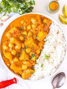 a white bowl filled with curry and rice