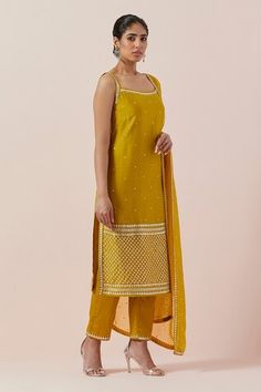 Mustard yellow kurta with aari, sequin and zari work in chanderi base. Paired with a cotton pant and silk organza dupatta with silver and gold hand embroidery. - Aza Fashions Yellow Silk Salwar Kameez With Chikankari Embroidery, Mustard Color Straight Kurta Set, Yellow Silk Churidar With Gota Work, Mustard Straight Kurta Sets, Yellow Sleeveless Set For Eid, Yellow Silk Churidar With Chikankari Embroidery, Yellow Palazzo Set With Mirror Work For Eid, Yellow Chanderi Kurta With Mirror Work, Yellow Palazzo Set With Straight Kurta And Pallu