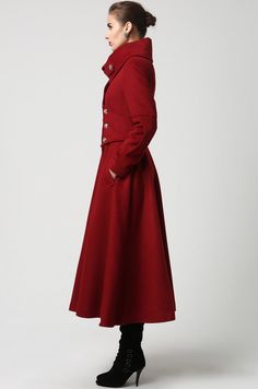 "This gorgeous long wool blend coat is highlighted by the over sized stand up collar and silver button detailing. When the collar is unbuttoned it falls nicely into a wide shawl-like lapel. The form fitting bodice leads into a long flowing skirt giving a nice accent of femininity to counterbalance the military styling. One of the nicest details is the wide cumber band style waistband that really accentuates the waist. The designer red wool coat is fully lined in polyester with deep side pockets. Solid Pea Coat With Stand Collar And Buttons, Red Wool Coat With Buttons For Fall, Red Long Pea Coat With Buttons, Red Wool Coat With Buttons For Winter, Red Long Wool Coat With Buttons, Military Long Coat, Long Flowing Skirts, Winter Coat Women, Military Style Coats