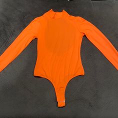 Fashion Nova Orange Body Suit. Size Small. Not Tag But Never Worn Trendy Fitted Orange Bodysuit, Trendy Orange Fitted Bodysuit, Trendy Orange Bodysuit For Spring, Orange Party Bodysuit For Spring, Fashion Nova Tops, Tops Fashion, Body Suit, Fashion Tops, Color Orange