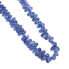 a strand of blue glass beads on a white background