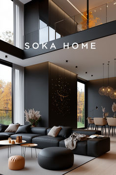 a living room filled with lots of furniture next to a tall glass wall that reads sokahome