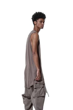 Body material: 100% cotton・Long tank top to accentuate your style with layering and more・Loose silhouette with a moderately relaxed feel・Light jersey material used for T-shirts, etc.・Rounded cut for a layered hemline・The draping that can only be achieved with long length garments.・Cotton jersey is soft and comfortable against the skin.・Lightweight fabric that does not bulk up when layeredCountry of origin / TURKIYE Relaxed-fit Model wear size: Large // 1/76 height 78 kg Measurement XSMALL Lenght Cotton Tank Top With Dropped Armholes For Summer, Cotton Vest For Summer Loungewear, Summer Cotton Muscle Tee For Loungewear, Summer Tank Vest For Layering, Oversized Sleeveless Tops For Layering, Summer Cotton Vest For Layering, Relaxed Fit Muscle Tee For Summer Layering, Summer Relaxed Fit Muscle Tee For Layering, Cotton Tank Vest For Layering