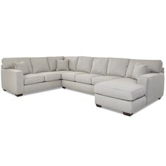 a large sectional couch sitting on top of a white floor