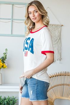 USA Contrast Trim Short Sleeve T-Shirt exudes a patriotic vibe with its bold contrast trim design inspired by the American flag colors. This shirt is a stylish way to show off your American pride while staying comfortable in its short sleeve silhouette. Perfect for celebrating national holidays or adding a touch of Americana to your everyday look. INCLUDES: T-Shirt AVAILABILITY: This item will ship separately from the rest of your order. Please allow 5-10 business days for shipping. FEATURES: Ma Sleeve Silhouette, Trim Design, Patriotic Fashion, The American Flag, National Holidays, Flag Colors, American Pride, Skirt Leggings, Contrast Trim