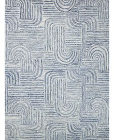 a blue and white rug with an abstract design on the bottom, it has wavy lines in