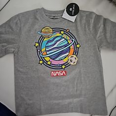 New With Tags Nasa Planets Kids Tshirts Size 7 And 8 Available New To Poshmark? Use Referral Code Mibellascloset To Save $10 Off! Orders Ship Within 24 Hours. Highly Rated Experienced Seller. Smoke-Free Home. Shop With Confidence. Nasa Planets, Tootsie Roll Pops, Planet For Kids, Nasa Shirt, Star Wars Tees, Kids Tshirt, Kids Soccer, Ralph Lauren Kids, Abercrombie Kids