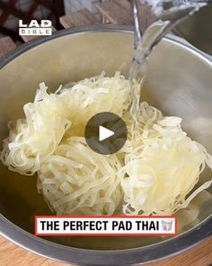 the video shows how to cook noodles in a pot with water being poured into it