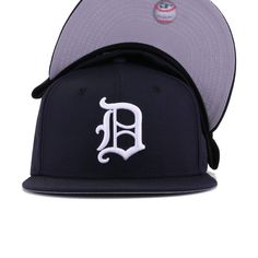 New Era Cap 59Fifty fitted hat for the Detroit Tigers in official team colors, designed with retro logo from 1966. This throwback Tigers fitted features the 1966 version of the blackletter D. Softer and less detailed than the current modern D, this fitted still doesn’t need any explaining to people. This is Detroit all the way. Hat Material: 100% WoolCrown: NavyVisor: NavyButton: NavyUndervisor: GreyFront Logo: Snow WhiteNew Era Flag: Midnight NavyRear Logo: Midnight Navy/Snow White/Orangeade Fitted Hat With Team Logo For Sports Events, Throwback Fitted Hat With Flat Brim For Sports Events, Throwback Flat Brim Fitted Hat For Sports Events, Flat Brim Baseball Cap With Team Logo For Streetwear, Classic Fitted Hat For Baseball Season, Classic Flat Crown Hat For Baseball Season, Throwback Baseball Cap For Sports Events, Classic Snapback Hat With Logo Patch For Baseball Season, Retro Fitted Hat For Baseball Season With Flat Bill