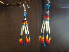 Native earrings of porcupine quills and hight quality seed beads full color . Colors: black - red - orange - yellow - blue They measure 2 3/4 inches with ear wires. For the Native American, the porcupine is an innocent child, a kind and loving personality . He teaches embrace the world with Porcupine Art, Porcupine Quill Jewelry, Native American Beadwork Patterns, Earrings Native American, Porcupine Quills, Beaded Earrings Native, Beadwork Designs, Native American Earrings, Beaded Earrings Diy