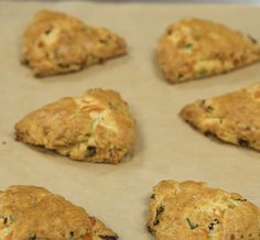 several biscuits are on a baking sheet ready to be baked