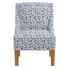 a blue and white leopard print chair with wooden legs