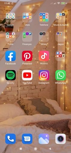 an image of a bed with many different app icons on the wall and below it