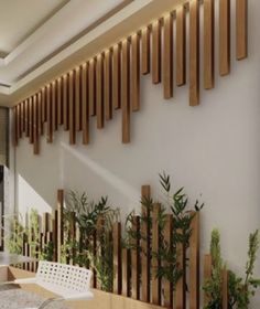 a dining room with wooden slats on the wall and white chairs in front of it