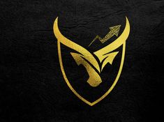 a black and gold logo with an eagle on it