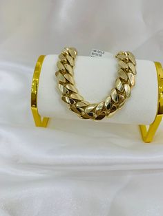 14k monaco bracelet  -14k 100% gold  -will not tarnish nor change color  -8.5 inches long  -15mm thick  -box lock system -lock can be personalize with initials  -semi-solid finisj design  -item sold by piece. weight is undetermined. Luxury Cuban Link Bracelet As Gift, Luxury Gold Chain Bracelet With Cuban Link, Luxury Cuban Link Gold Chain Bracelets, Luxury Cuban Link Bracelet As Gift With Solid Construction, Luxury Cuban Link Gold Chain Bracelet, Luxury Curb Chain Cuban Link Bracelet, Luxury Cuban Link Bracelet With Polished Finish As Gift, Luxury Polished Cuban Link Bracelet As Gift, Luxury 14k Gold Bracelets With Curb Chain