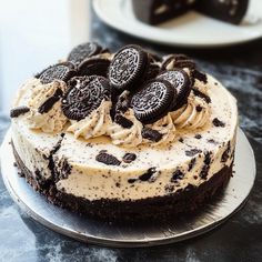 an oreo cookies and cream cake on a plate