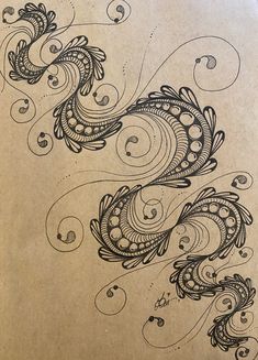 an artistic drawing on paper with swirls and dots