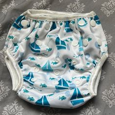 Blue And White Swim Diaper One Size - Multiple Snap Buttons For Size Adjustment Sailboat And Blue Fish Print - Perfect For Summer Beach / Lake Weather Nwot / Never Used Blue Bottoms For Playtime, Machine Washable, Blue Bottoms For Playwear, Machine Washable, Blue Playwear Bottoms Machine Washable, Playful White Machine Washable Bottoms, White Swim, Blue Fish, Fish Print, Kids Swimming, Summer Beach