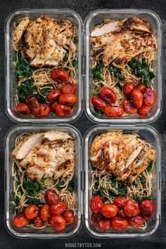 four plastic containers filled with chicken, tomatoes and noodles