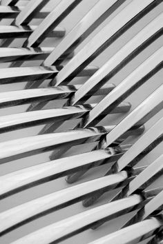 several surfboards are stacked on top of each other in black and white photo with the sun shining through them