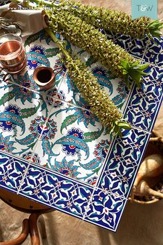 an assortment of herbs on a blue and white tray