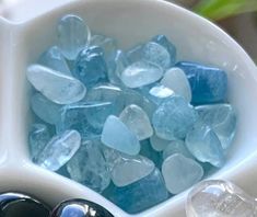 some blue and white rocks in a bowl