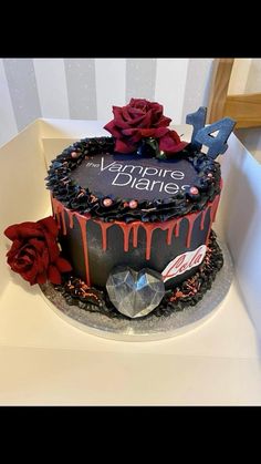 a birthday cake decorated with roses and chocolate icing